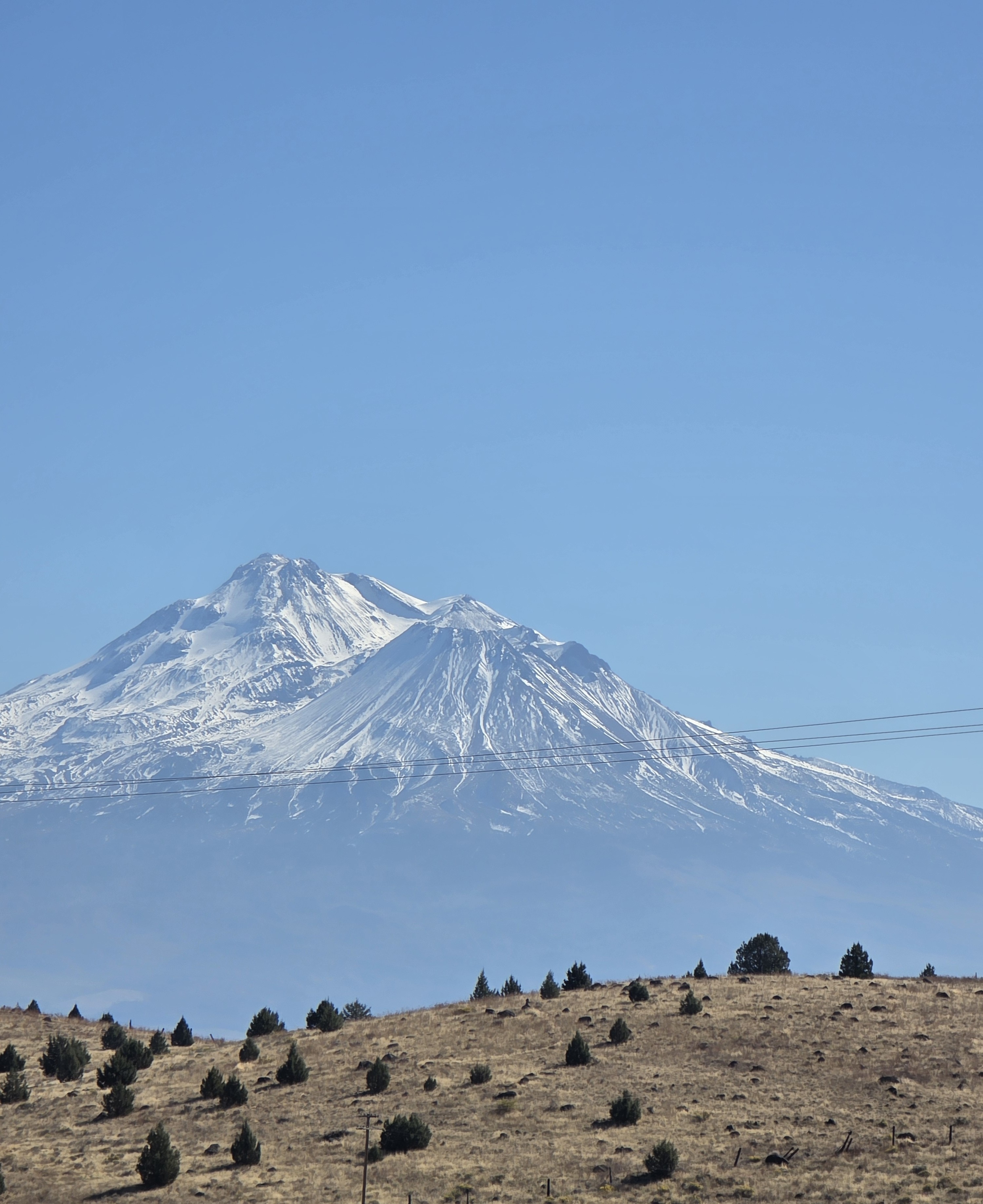 Mt. Shasta covered in fresh snow under bright midday light, symbolizing clarity and renewal through prayer and trust in God.
